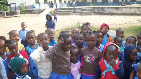 In 2008, children await building to begin.